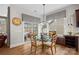 Breakfast nook in kitchen with glass table and access to backyard patio at 16015 Vale Ridge Dr # 133, Charlotte, NC 28278