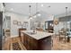 Gourmet kitchen with large island, granite countertops, and stainless steel appliances at 16015 Vale Ridge Dr # 133, Charlotte, NC 28278