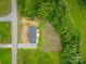 Aerial view of the property showcasing its location, yard, and surrounding greenery at 55 Shannon Park Cir, Taylorsville, NC 28681