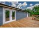Beautiful house has a large back porch with door access to the house and stairs to the yard at 55 Shannon Park Cir, Taylorsville, NC 28681