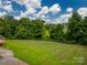 Home features a large, grassy backyard, perfect for outdoor activities and relaxation at 55 Shannon Park Cir, Taylorsville, NC 28681