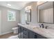 Bathroom with double vanity, granite countertop, and modern fixtures at 55 Shannon Park Cir, Taylorsville, NC 28681