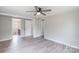 Light-filled bedroom with light-colored wood flooring and doorways to other rooms at 55 Shannon Park Cir, Taylorsville, NC 28681