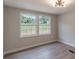 Bedroom featuring hardwood floors, recessed lighting, and two windows with natural light at 55 Shannon Park Cir, Taylorsville, NC 28681
