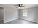 Bedroom featuring hardwood floors, ceiling fan, and window with natural light at 55 Shannon Park Cir, Taylorsville, NC 28681