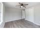 Bedroom featuring hardwood floors, ceiling fan, and closet with bi-fold doors at 55 Shannon Park Cir, Taylorsville, NC 28681