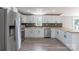 Modern kitchen boasts stainless steel appliances, stylish backsplash, and light wood countertops at 55 Shannon Park Cir, Taylorsville, NC 28681