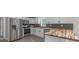 Modern kitchen featuring stainless steel appliances, white cabinets, and butcher block countertops at 55 Shannon Park Cir, Taylorsville, NC 28681