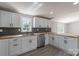 Kitchen featuring white cabinets, butcher block counters, stainless steel appliances, and herringbone backsplash at 55 Shannon Park Cir, Taylorsville, NC 28681