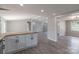 Open-concept kitchen features a butcher block island, gray cabinets, and new flooring at 55 Shannon Park Cir, Taylorsville, NC 28681
