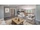 Open-concept living and dining area with neutral tones and ample natural light at 55 Shannon Park Cir, Taylorsville, NC 28681
