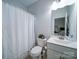 Bathroom with toilet, sink, and shower at 209 Meyers Ridge Rd, Cramerton, NC 28032