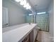 Bathroom with double vanity and shower at 209 Meyers Ridge Rd, Cramerton, NC 28032