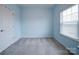 Blue bedroom with carpet and a window at 209 Meyers Ridge Rd, Cramerton, NC 28032