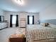 Large bedroom with a king-size bed and neutral decor at 209 Meyers Ridge Rd, Cramerton, NC 28032