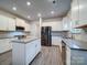 Spacious kitchen with white cabinets, stainless steel appliances, and an island at 209 Meyers Ridge Rd, Cramerton, NC 28032