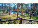 Picturesque backyard with direct water access and a private dock, surrounded by beautiful trees at 301 Agnew Rd, Mooresville, NC 28117