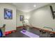 Home gym featuring a rubber floor, workout equipment, and mirrors at 301 Agnew Rd, Mooresville, NC 28117