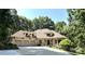 Beautiful stone home featuring a three car garage and well manicured landscaping at 301 Agnew Rd, Mooresville, NC 28117