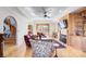 Elegant living room featuring hardwood floors, fireplace, and access to the outdoor space at 301 Agnew Rd, Mooresville, NC 28117