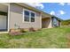 Tan and gray siding homes with covered patios and landscaping at 1511 28Th Street Se Pl, Hickory, NC 28602