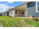 Tan and gray siding homes with covered patios at 1511 28Th Street Se Pl, Hickory, NC 28602