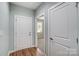 Bright hallway with two closed doors and wood flooring at 1511 28Th Street Se Pl, Hickory, NC 28602