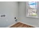 Laundry room with wood flooring and window at 1511 28Th Street Se Pl, Hickory, NC 28602