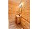 Rustic bathroom featuring a wood vanity, a mirror, and wood walls at 1586 Kenlane Dr, Hickory, NC 28601