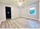 A well-lit bedroom features modern flooring, neutral walls, and a ceiling fan with an attached light at 1586 Kenlane Dr, Hickory, NC 28601