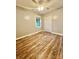 Cozy bedroom with hardwood floors, neutral walls, and a ceiling fan for comfort at 1586 Kenlane Dr, Hickory, NC 28601