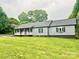 Charming one-story house with covered front porch and well-manicured lawn at 1586 Kenlane Dr, Hickory, NC 28601