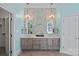 Double vanity bathroom with patterned tile, light color palette, and ample counter space at 170 Old Post Rd, Mooresville, NC 28117