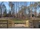 Deck view of backyard and surrounding trees at 170 Old Post Rd, Mooresville, NC 28117