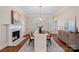 Elegant dining room featuring hardwood floors, a fireplace, and large windows at 170 Old Post Rd, Mooresville, NC 28117