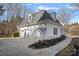 Three-car garage with white exterior and a paved driveway at 170 Old Post Rd, Mooresville, NC 28117