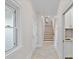 Elegant hallway with tiled floors, staircase, and neutral color palette at 170 Old Post Rd, Mooresville, NC 28117