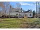 House back view, deck, pizza oven and stone patio at 170 Old Post Rd, Mooresville, NC 28117