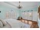 Main bedroom with hardwood floors, French doors to deck and calming color scheme at 170 Old Post Rd, Mooresville, NC 28117