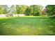 Large grassy backyard with a wooden fence at 609 Rowan Mills Rd, Salisbury, NC 28147