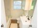 Updated bathroom with white vanity, bathtub, and marble-look tile at 609 Rowan Mills Rd, Salisbury, NC 28147