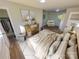 Main bedroom with dresser and cozy sitting area at 609 Rowan Mills Rd, Salisbury, NC 28147