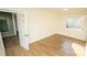 Bright bedroom featuring light wood flooring and a closet at 609 Rowan Mills Rd, Salisbury, NC 28147