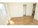 Simple bedroom with wood-look floors and closet at 609 Rowan Mills Rd, Salisbury, NC 28147