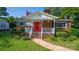 Brick ranch house with a red front door and a white porch at 609 Rowan Mills Rd, Salisbury, NC 28147