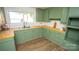 Updated kitchen, green cabinets, butcher block countertops at 609 Rowan Mills Rd, Salisbury, NC 28147