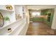 Renovated kitchen with green cabinets and new flooring at 609 Rowan Mills Rd, Salisbury, NC 28147