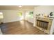 Living room with hardwood floors and a stone fireplace at 609 Rowan Mills Rd, Salisbury, NC 28147