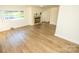 Bright living room with hardwood floors and a stone fireplace at 609 Rowan Mills Rd, Salisbury, NC 28147