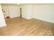 Spacious living room featuring light wood laminate flooring at 609 Rowan Mills Rd, Salisbury, NC 28147